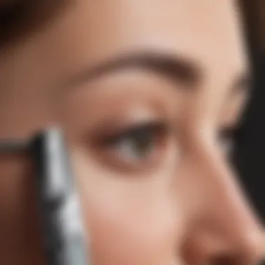 Close-up of an electric eyebrow trimmer highlighting its precision blade