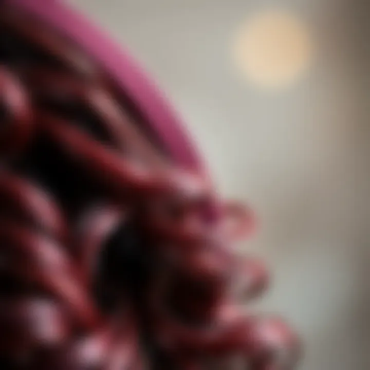 Close-up of the texture and curls of a burgundy headband wig