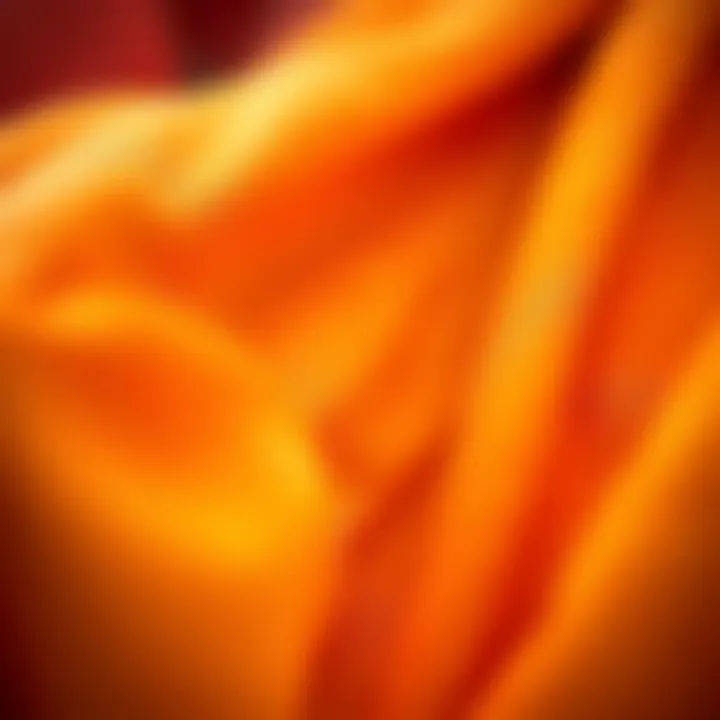 Close-up of fabric textures used in orange rave apparel, highlighting unique materials and craftsmanship.