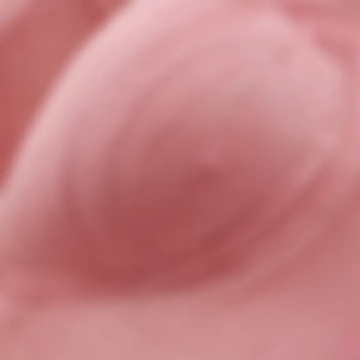 Close-up of the fabric texture of a pink strapless push up bra.