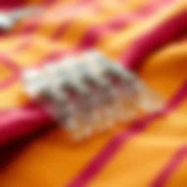 Aesthetic arrangement of clear clothespins on a vibrant fabric